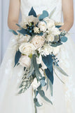 White and Blue Hand Holding Bridal Bouquet