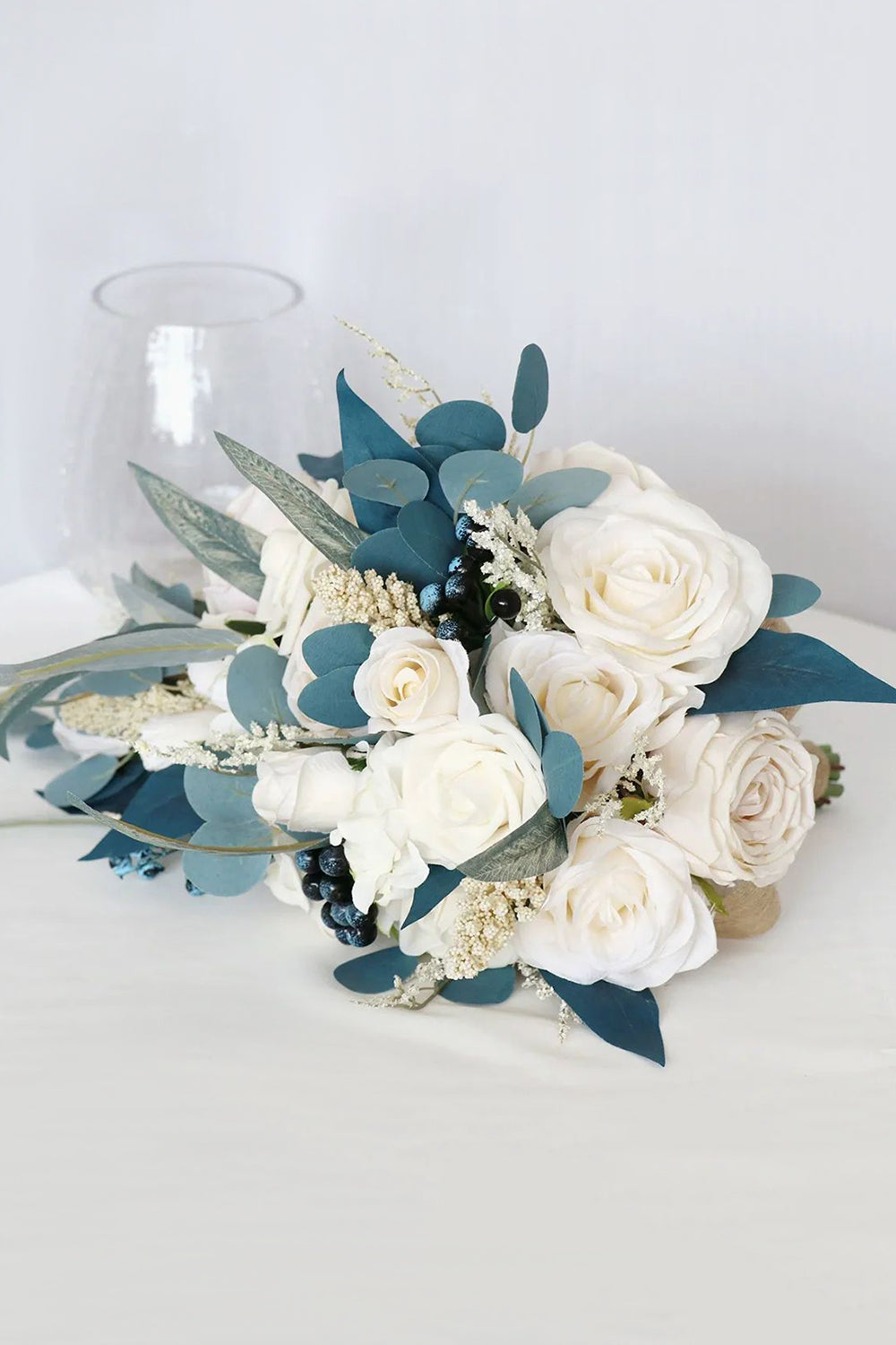 White and Blue Hand Holding Bridal Bouquet