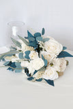 White and Blue Hand Holding Bridal Bouquet