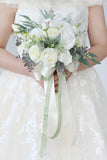 White Hand Holding Flower Bridal Bouquet with Bow