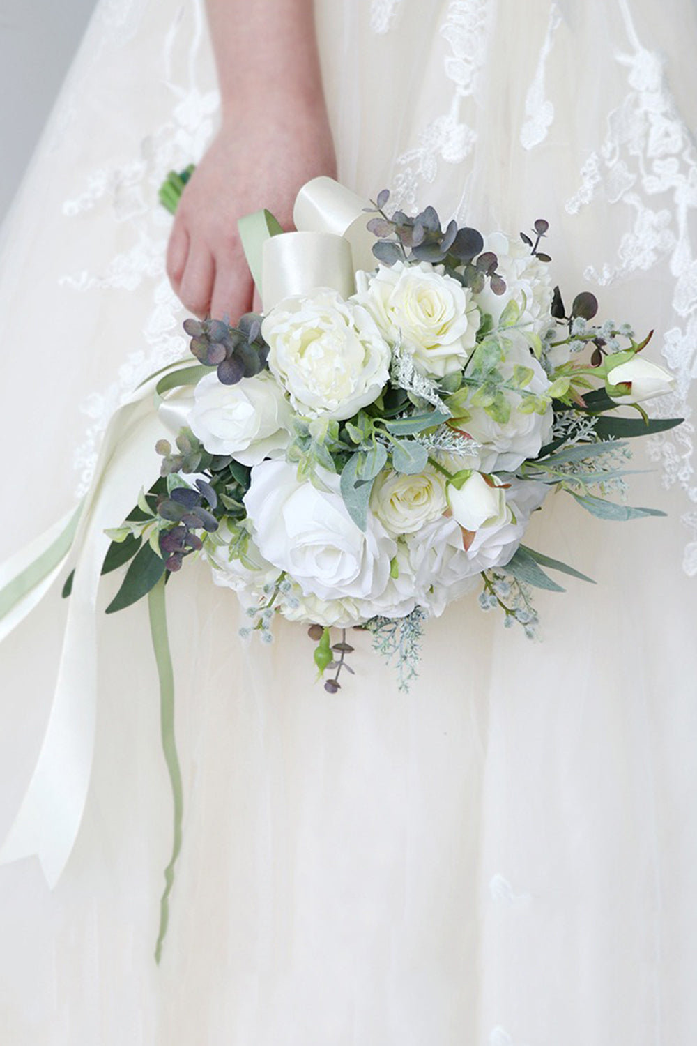 White Hand Holding Flower Bridal Bouquet with Bow