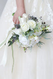 White Hand Holding Flower Bridal Bouquet with Bow