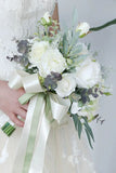 White Hand Holding Flower Bridal Bouquet with Bow